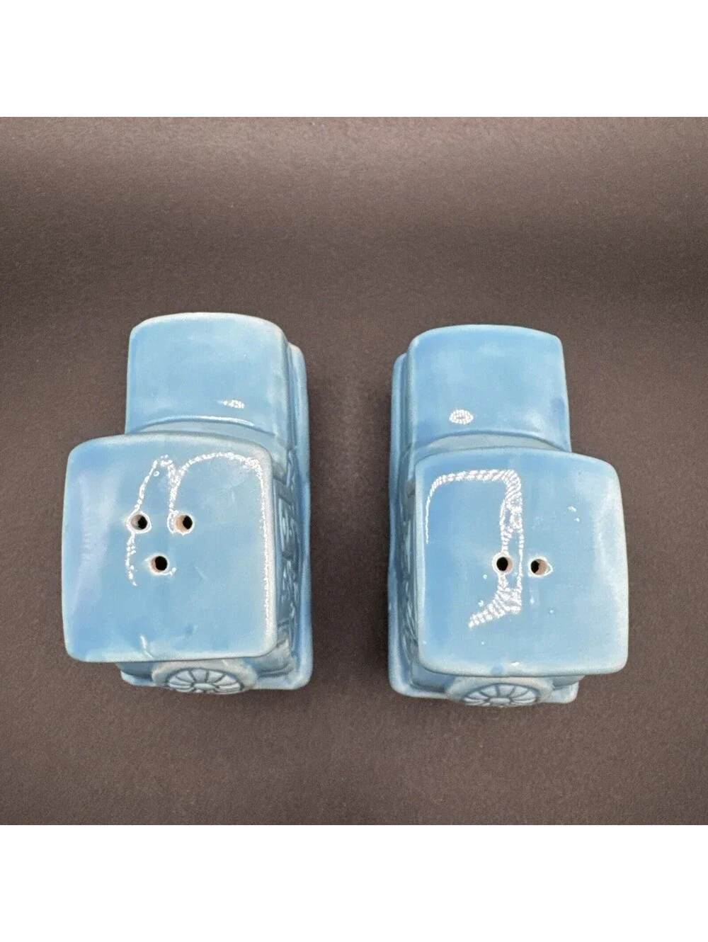N/A add a dash of vintage charm to your dining experience with these ceramic blue car salt and pepper shakers  originating from japan in the 1960s